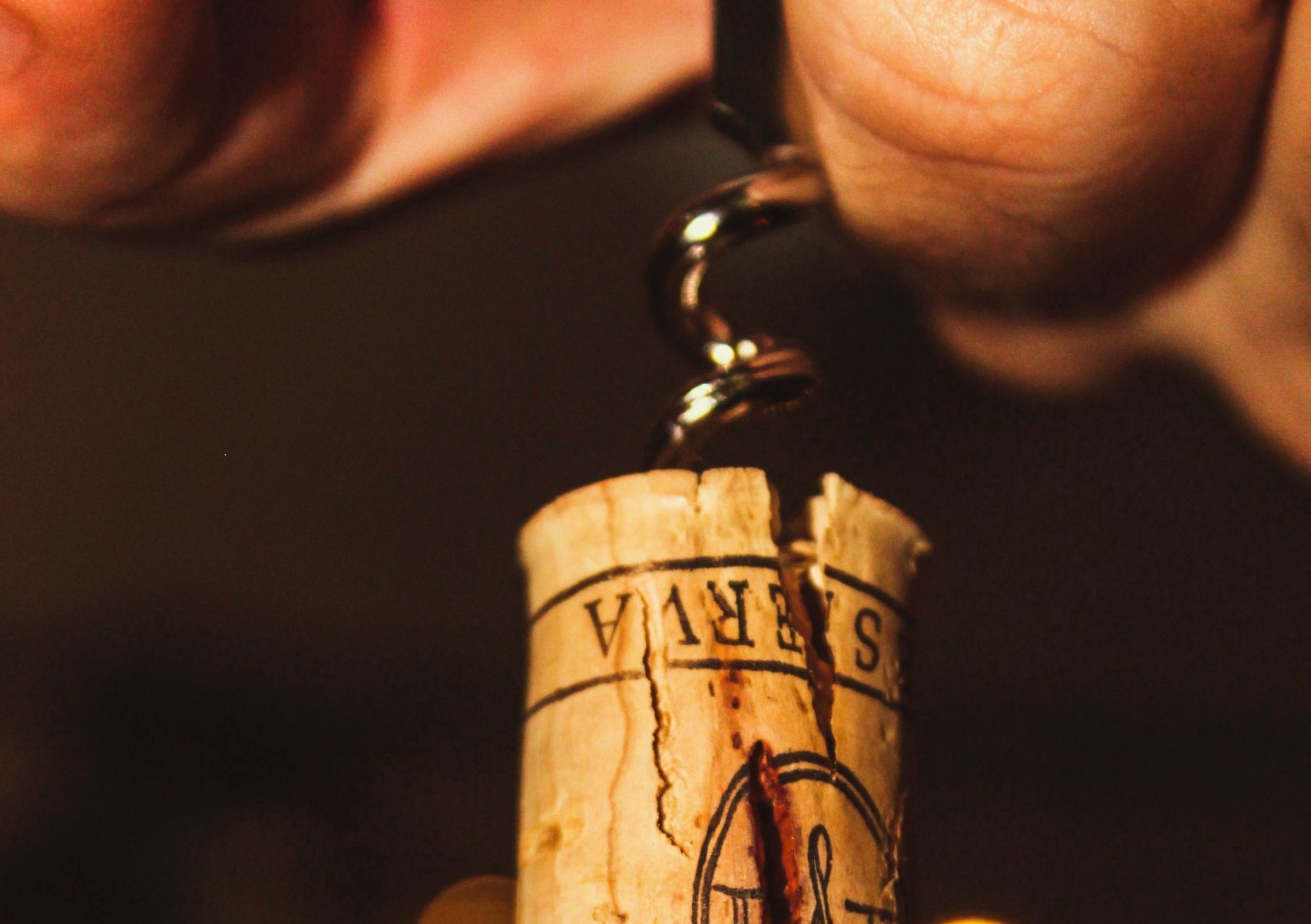 Close-up of a wine cork stained with red wine, symbolizing the refined expertise of our elite local wine guide.