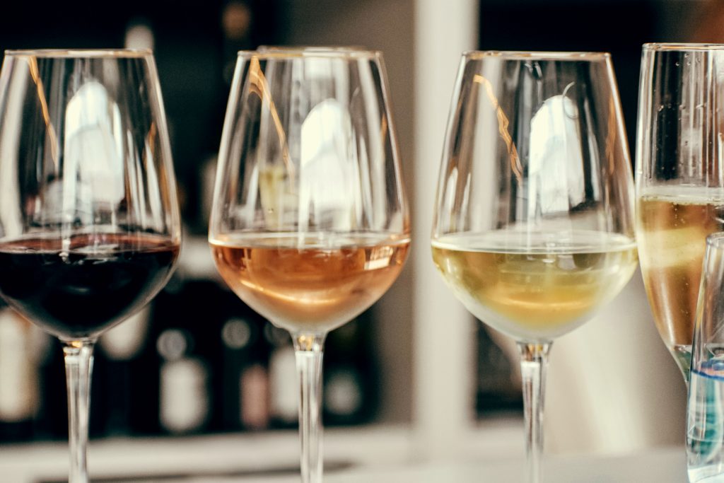 glasses of red, rosé, white, and sparkling wine ready for œlysium tasting selections